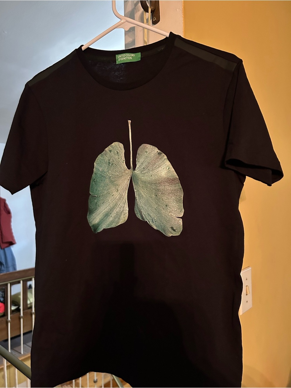 United Colors Of Benetton Black Top with Green Logo Tag, leaf/ lungs